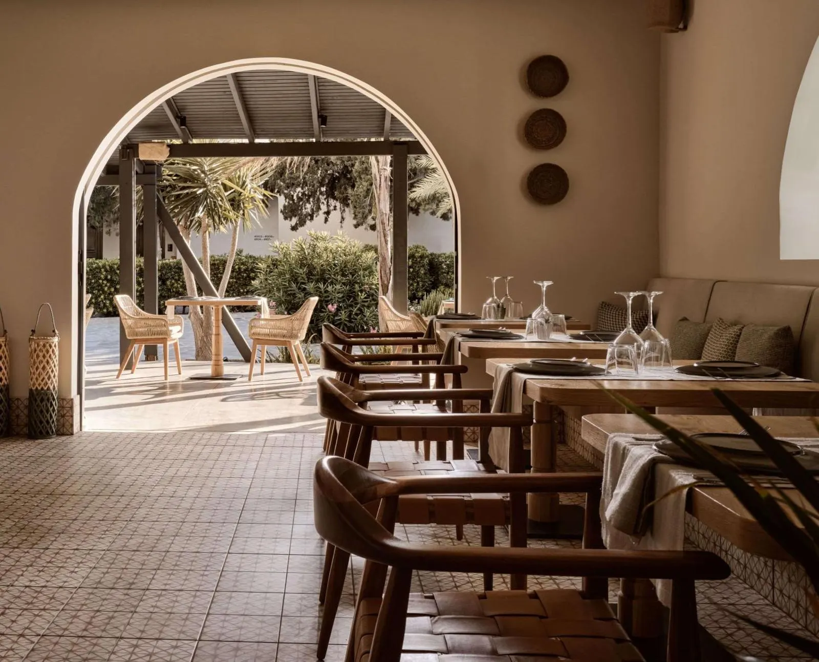 Restaurant seating under stone archway