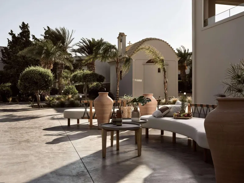 Outdoor lounge area with arched building