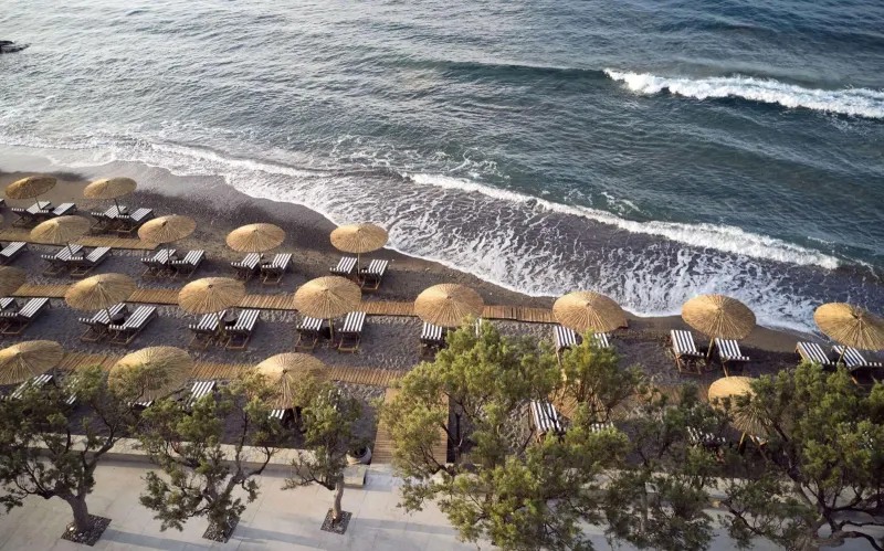 Aerial view of beach umbrellas and shoreline