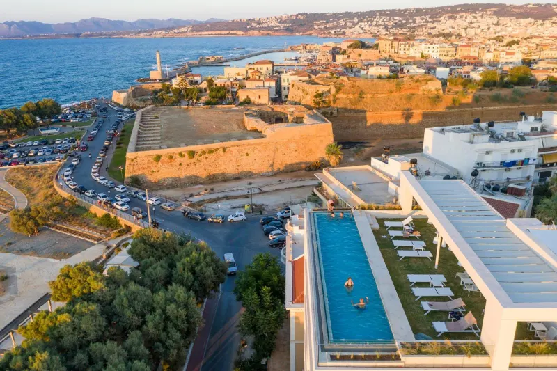 Aerial view of rooftop pool beside historic fortress