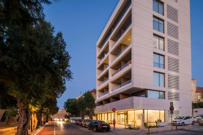 Exterior facade of hotel building at dusk