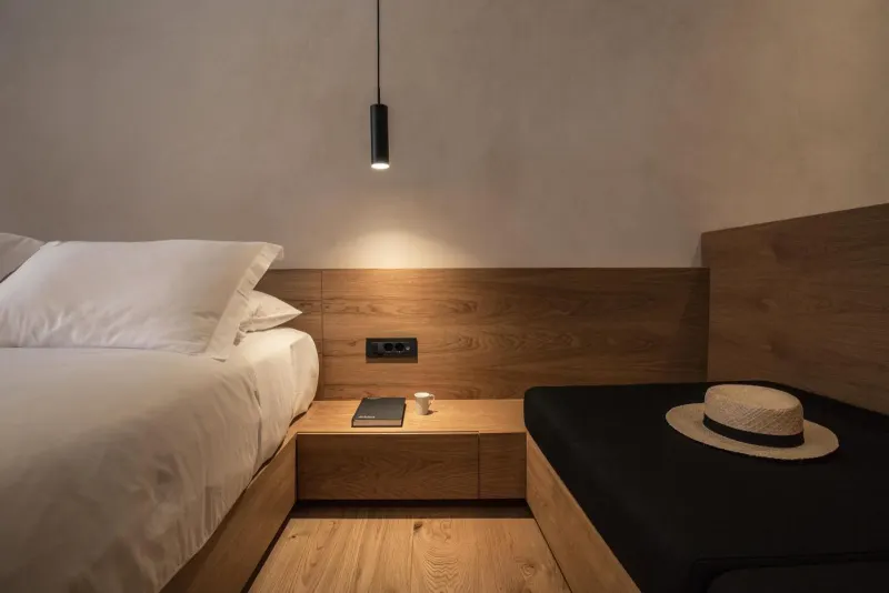 Bedside table with lamp and hat