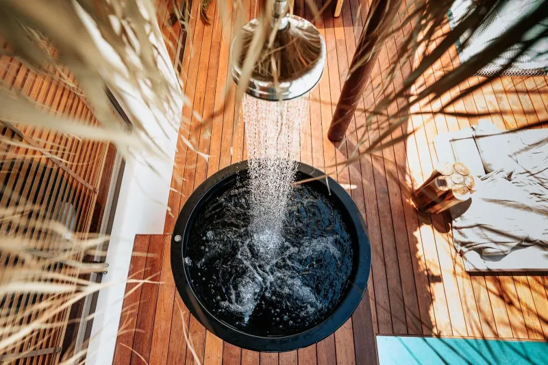 Close-up of outdoor shower over hot tub