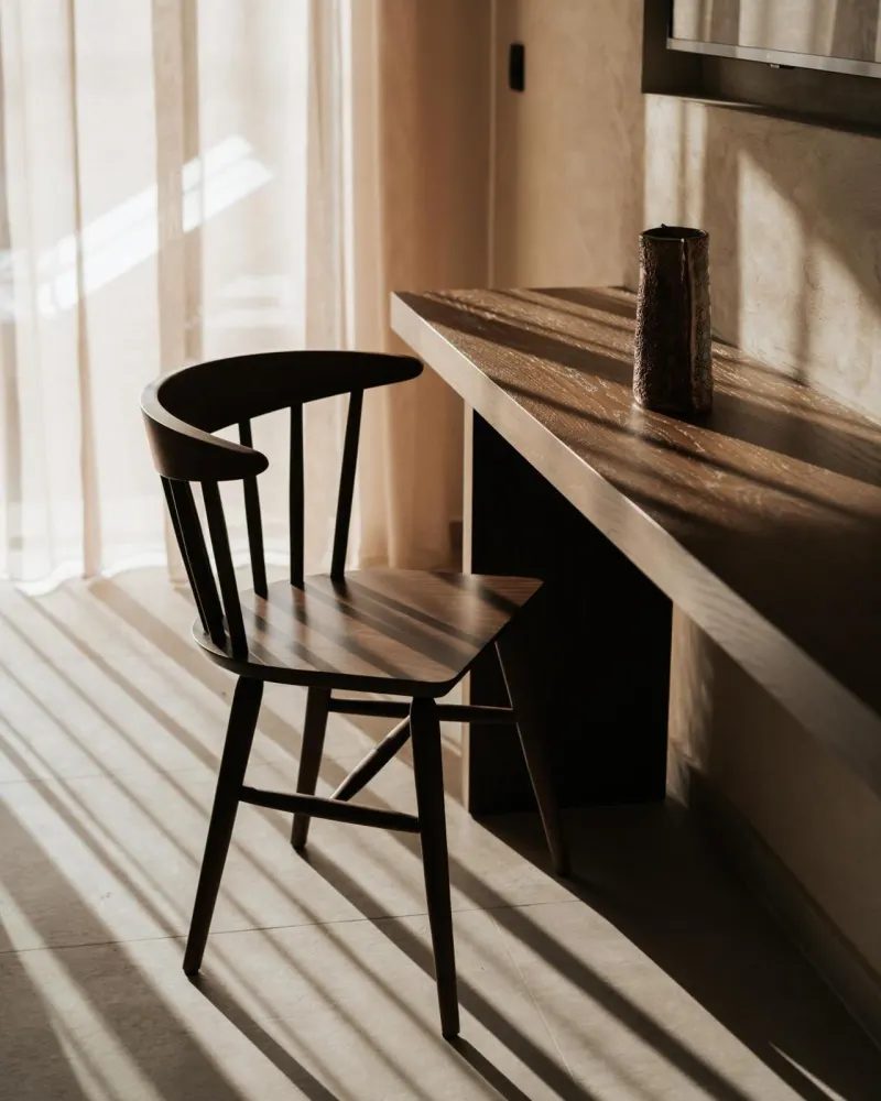 Wooden chair and desk in sunlight