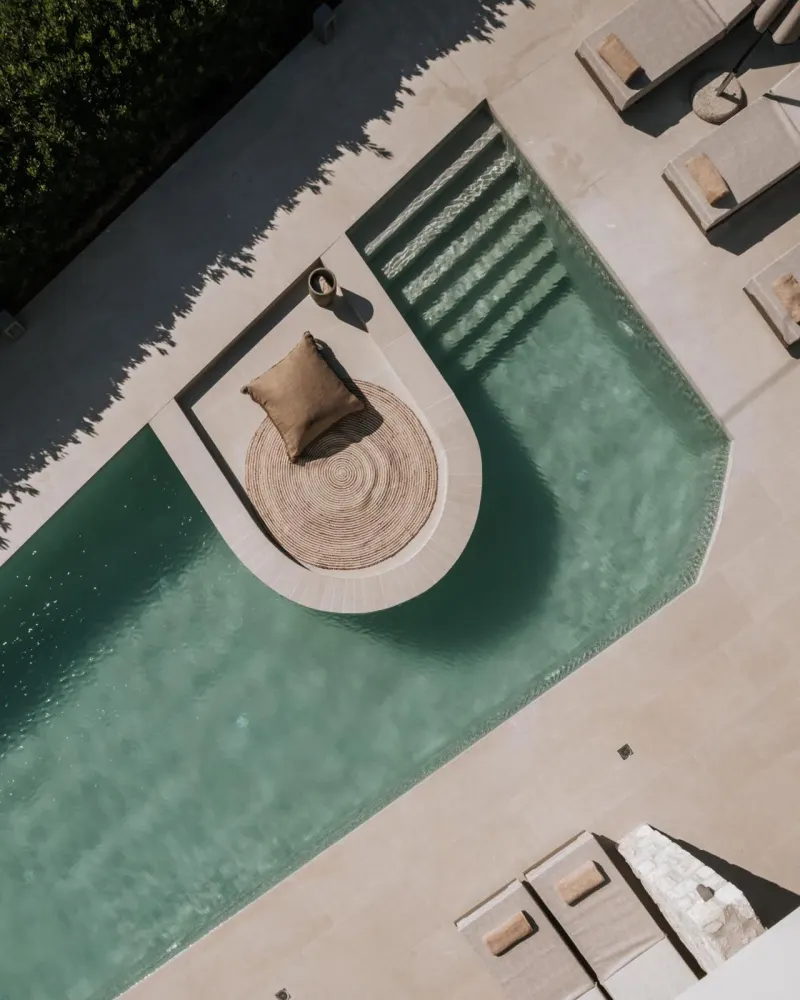 Aerial view of pool with daybed