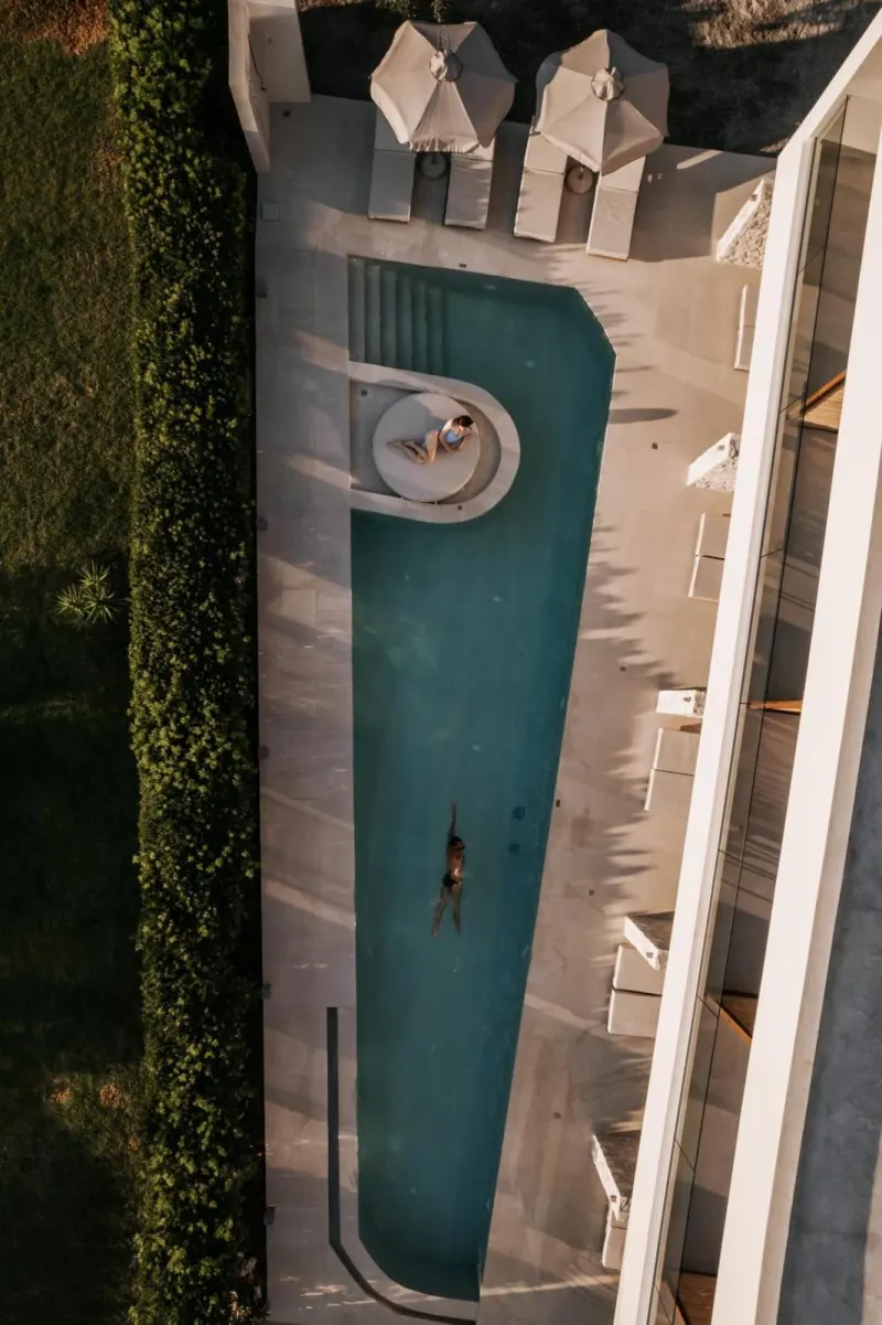 Aerial view of long pool with swimmer