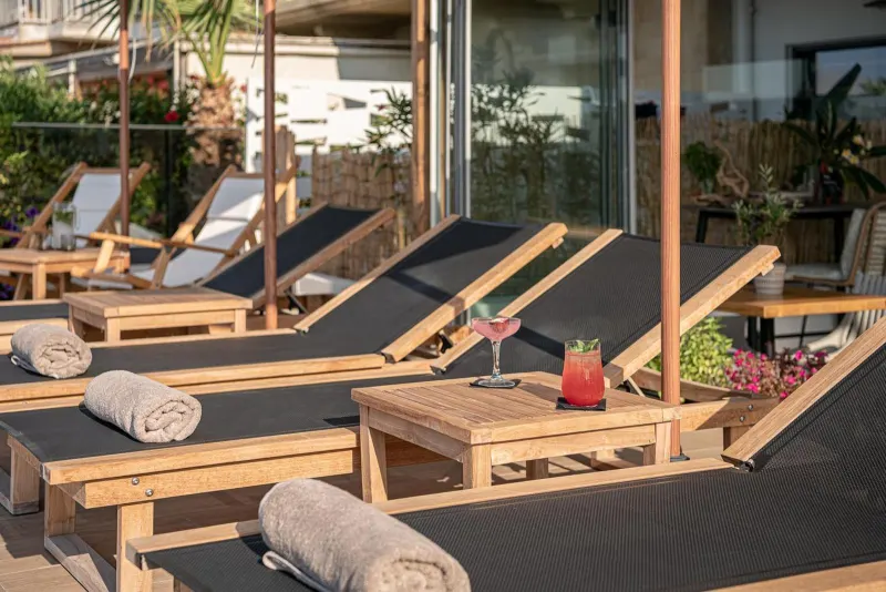 Sun loungers with drinks on terrace