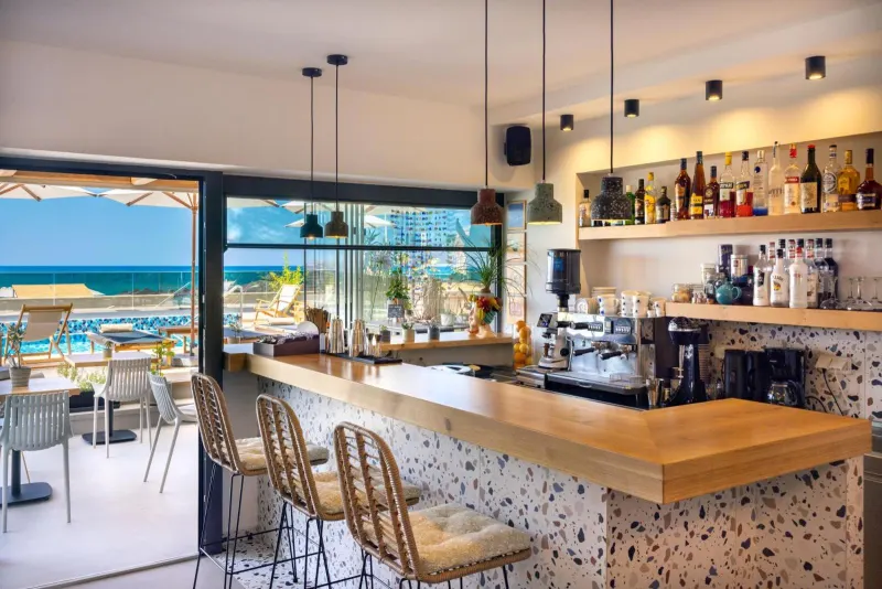 Bar counter with sea view and stools