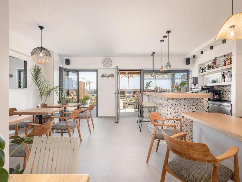 Bright cafe seating area with bar