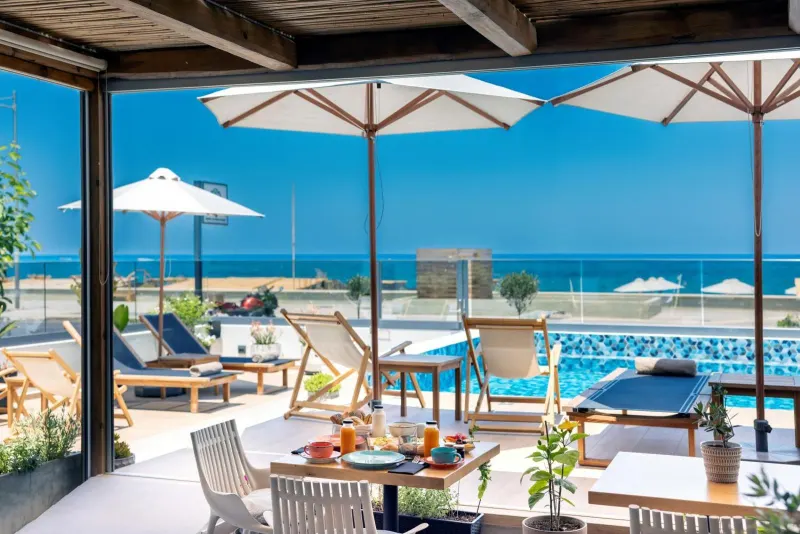 Poolside breakfast table with sea view