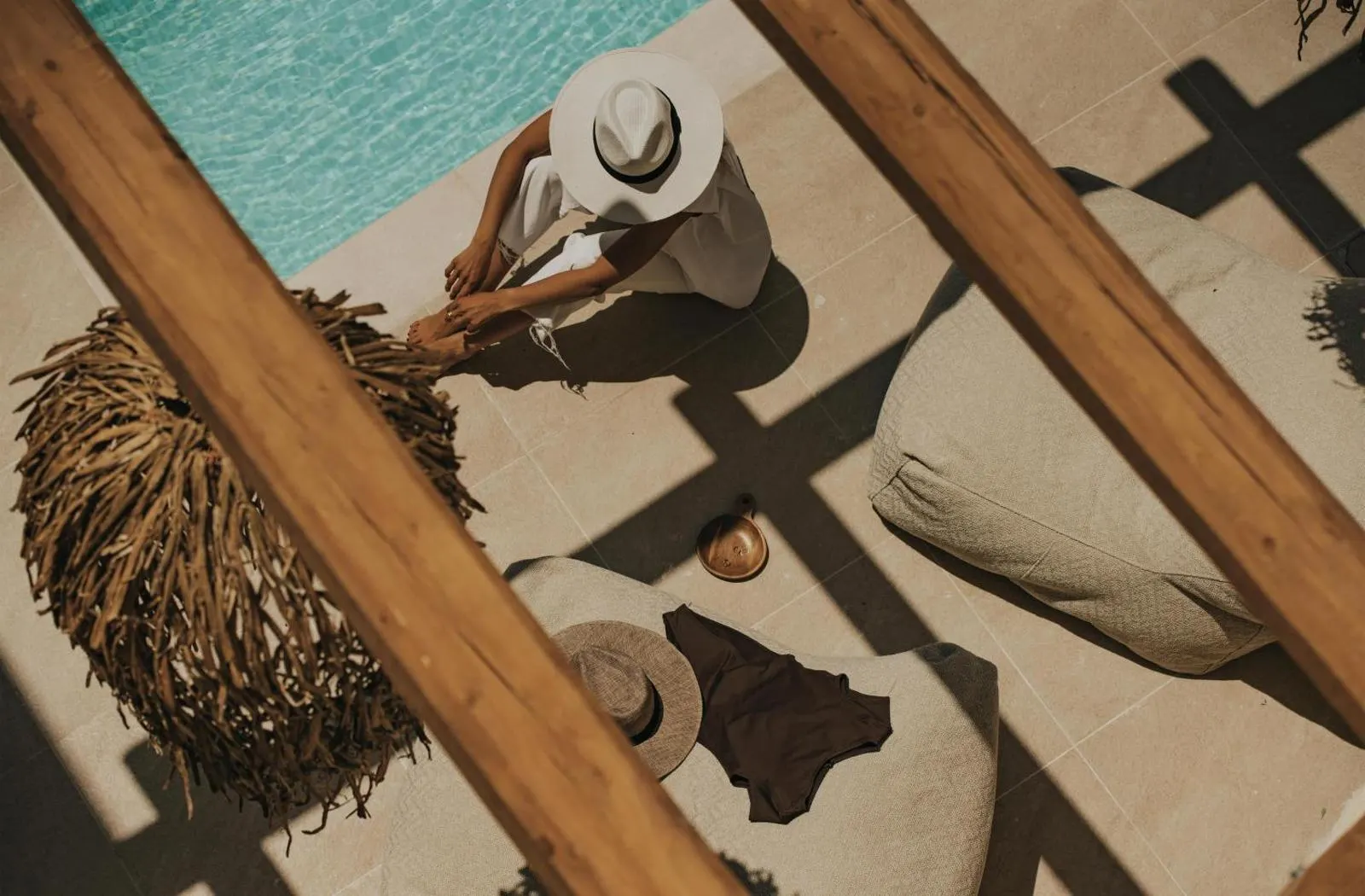 Overhead view of pool deck with woven decor