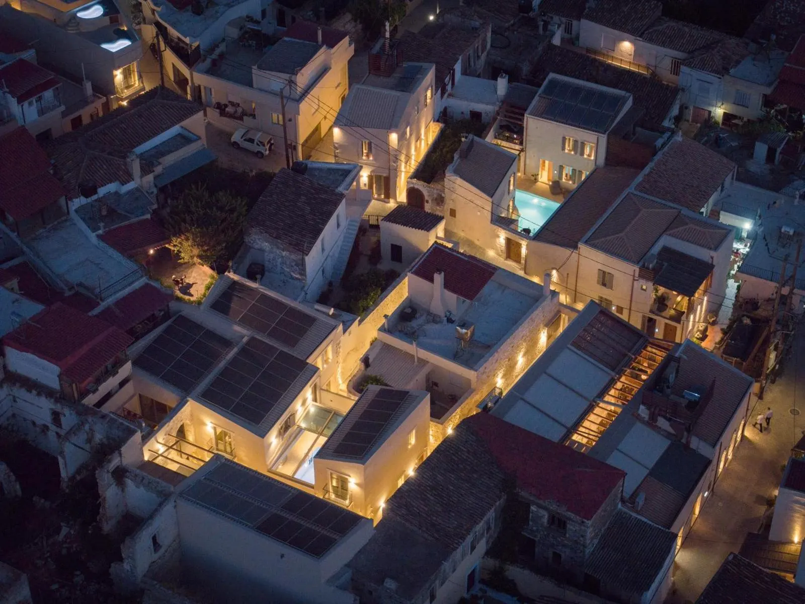 Aerial night view of hotel rooftops in village