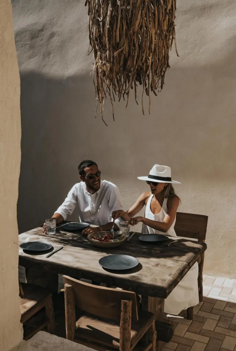 Couple enjoying meal at outdoor table