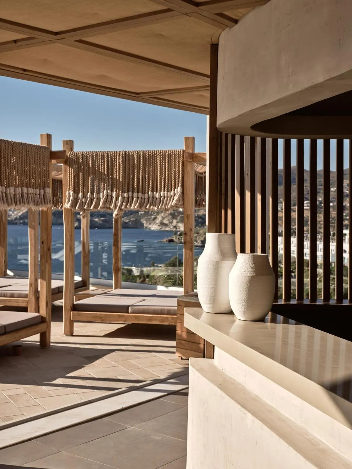 Wooden lounge terrace overlooking sea bay