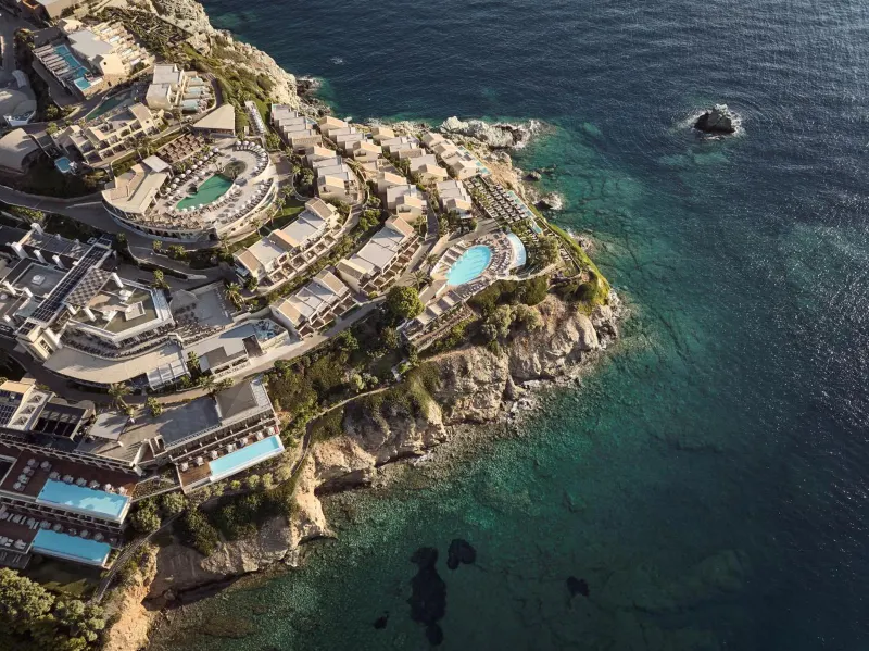 Aerial view of resort complex on rocky coastline