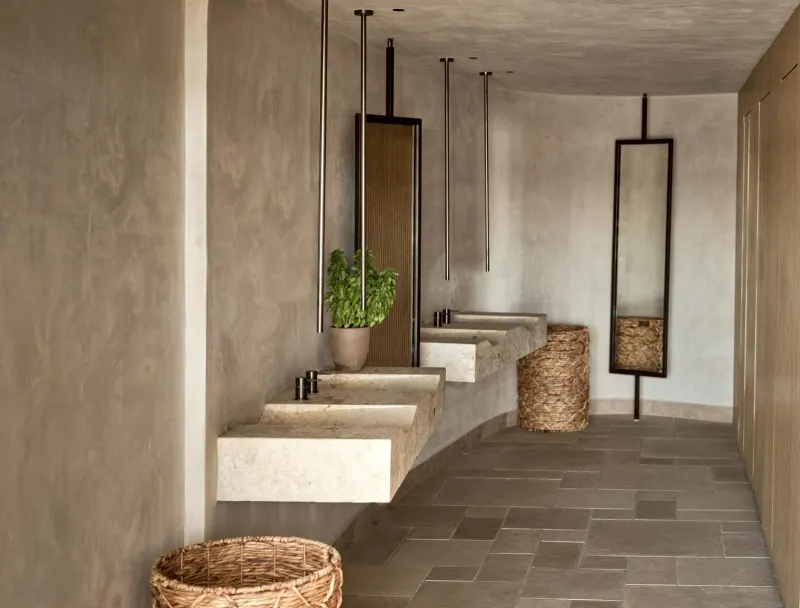 Spa hallway with stone sinks and mirrors