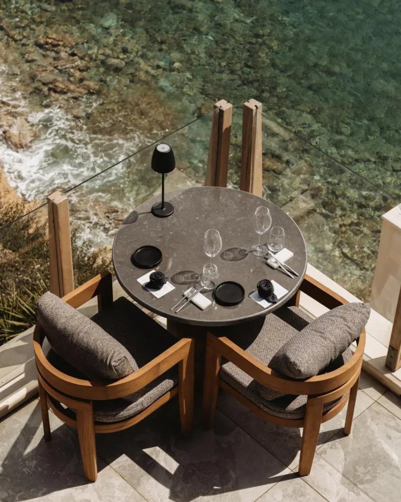 Table set for two above clear water