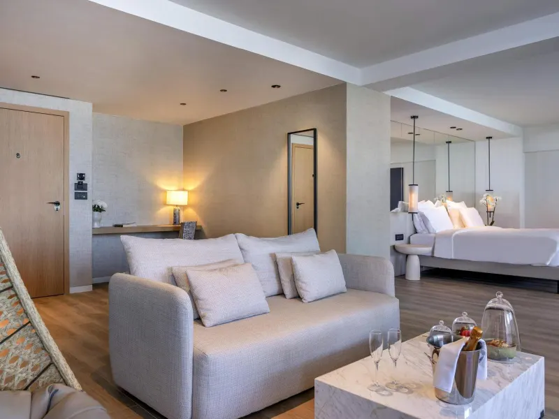 Suite living area with sofa and champagne setup