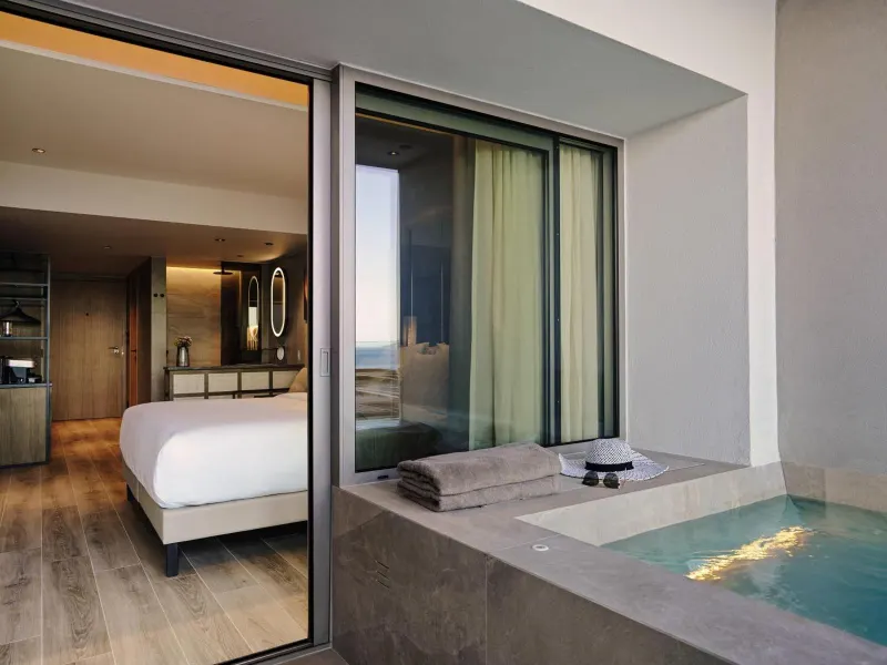 Private terrace jacuzzi with sea view at dusk