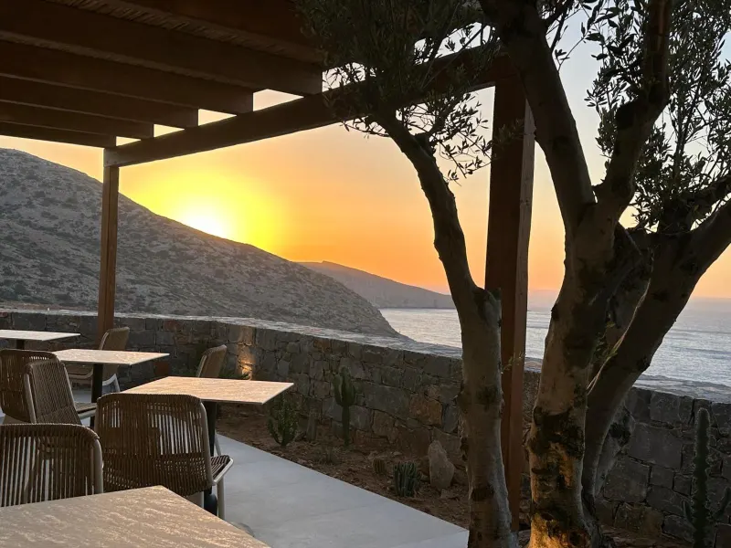 Pergola terrace overlooking sunset and coastline