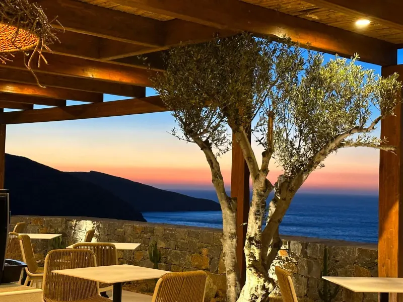 Pergola terrace with olive tree and sunset view