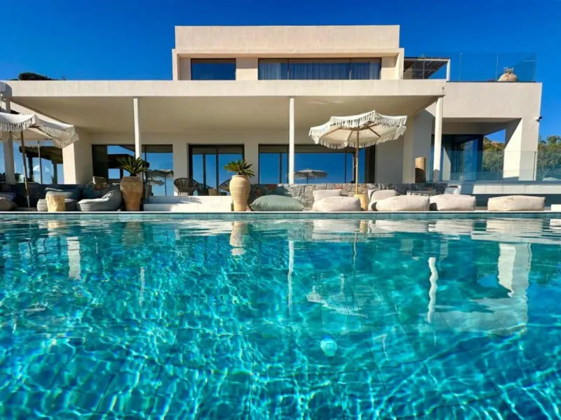 Villa exterior with infinity pool and sea view