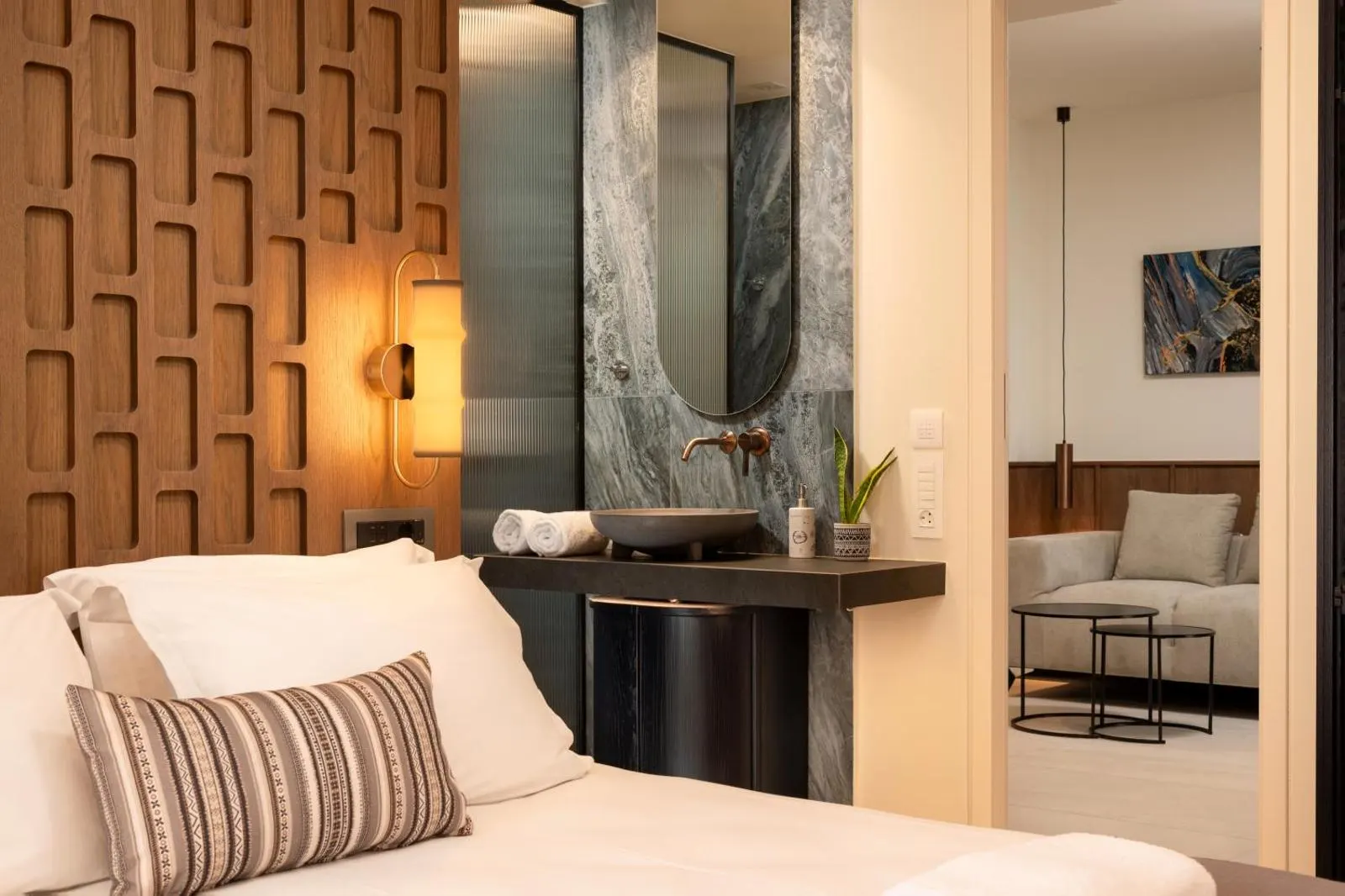 Bedroom with marble bathroom vanity view