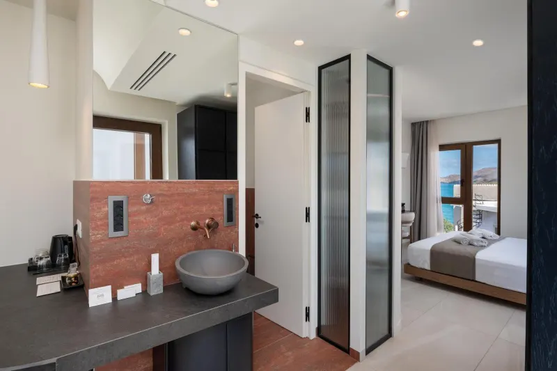 Bathroom sink with view into bedroom