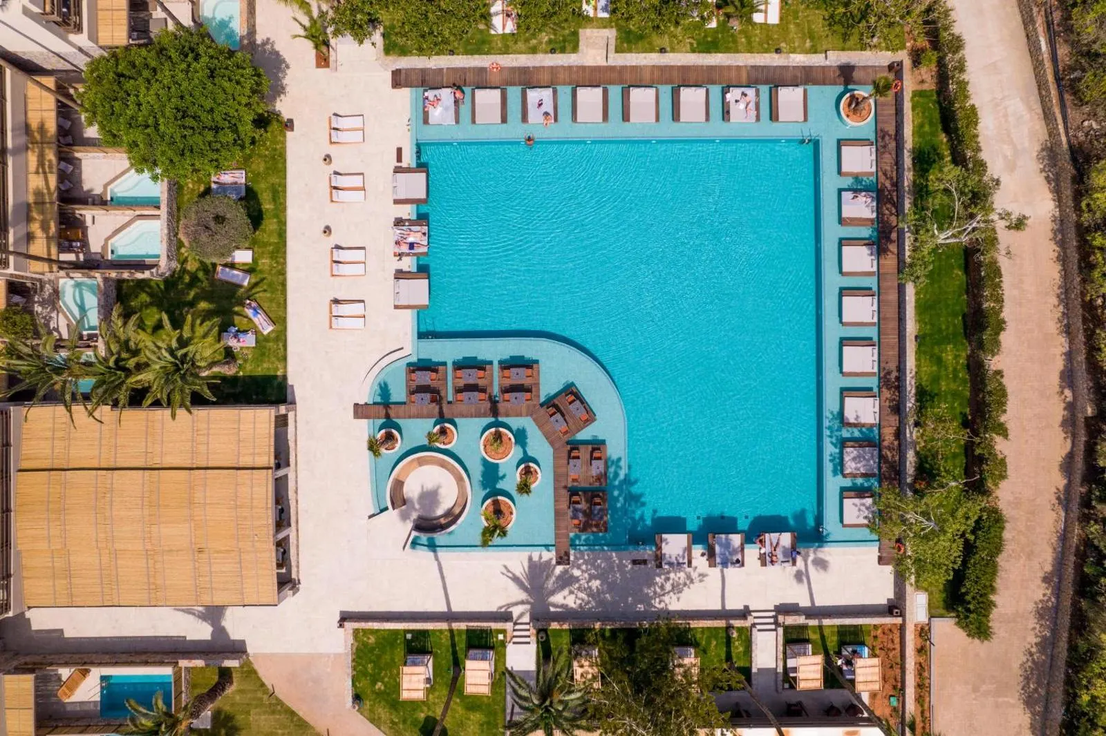 Aerial view of curved pool with loungers