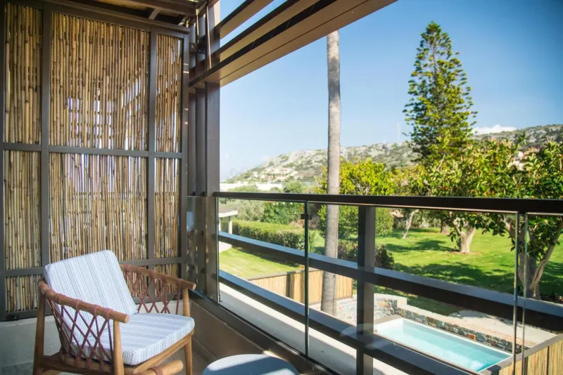 Balcony chair overlooking garden and hills