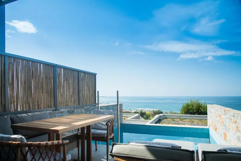Rooftop terrace with sea view and dining table