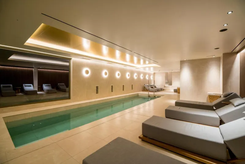 Indoor lap pool with loungers