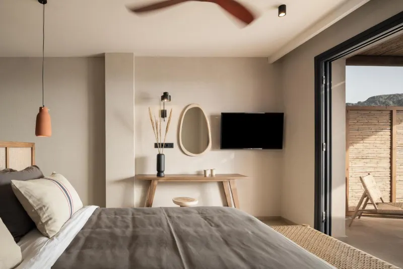 Bedroom with desk mirror and terrace doors open