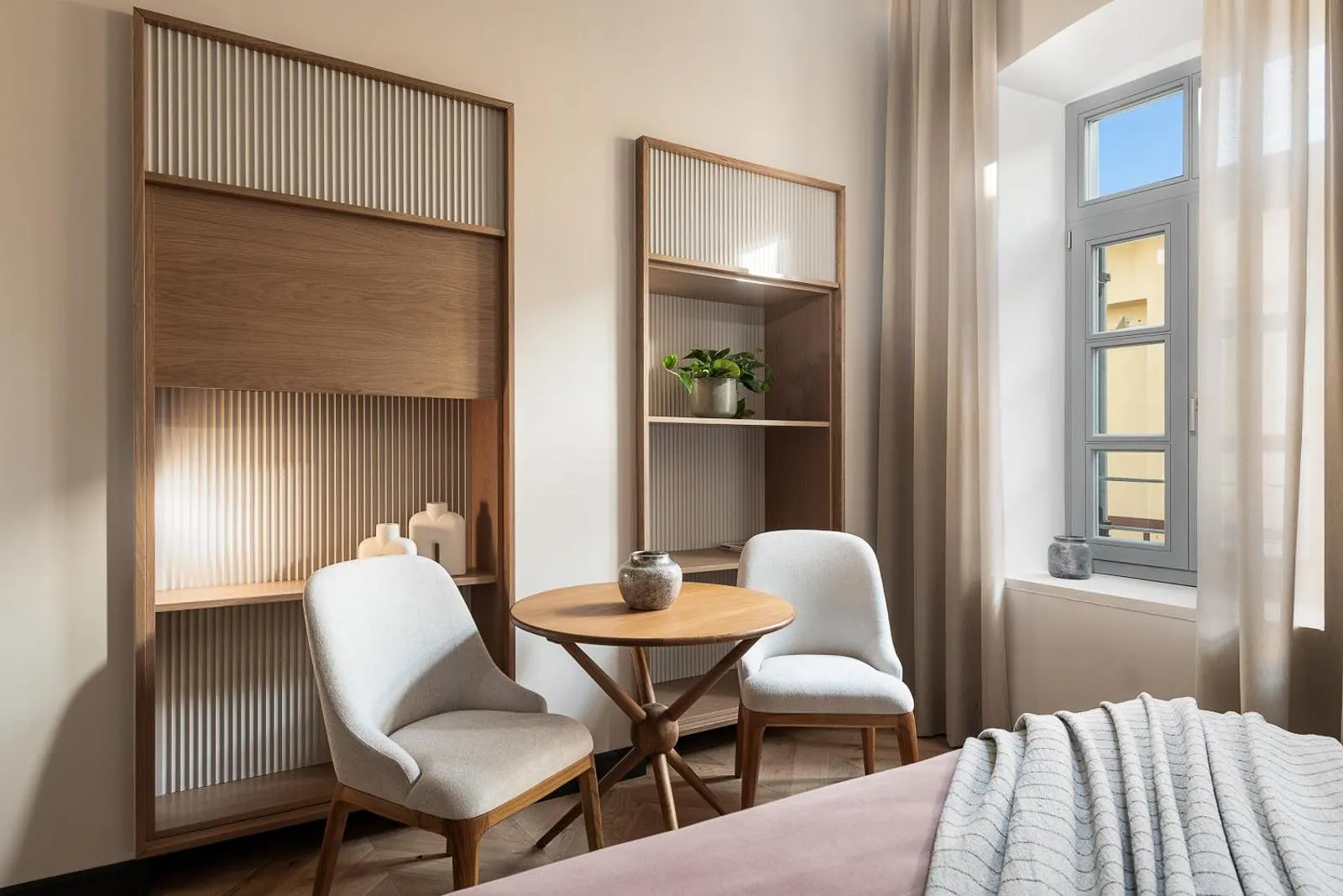 Bedroom nook with small table and chairs