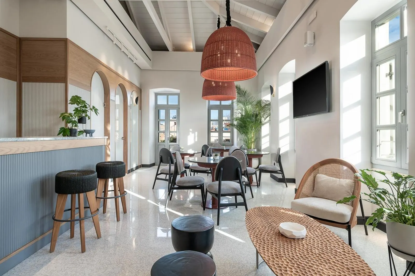 Lounge area with bar and rattan pendant lights
