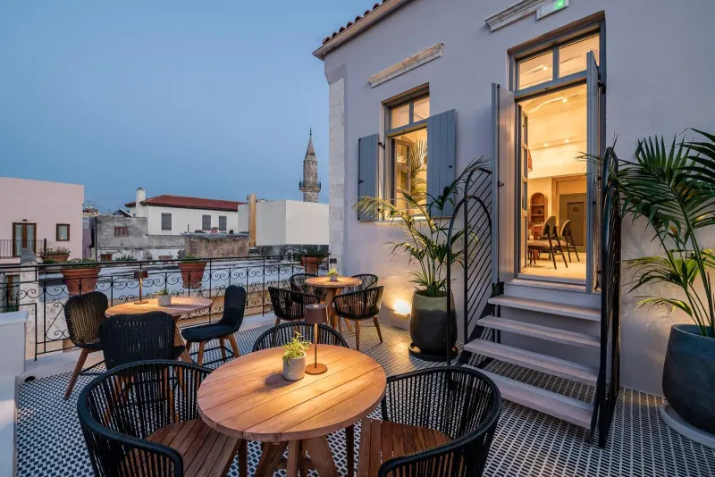 Terrace with open doors and evening lighting