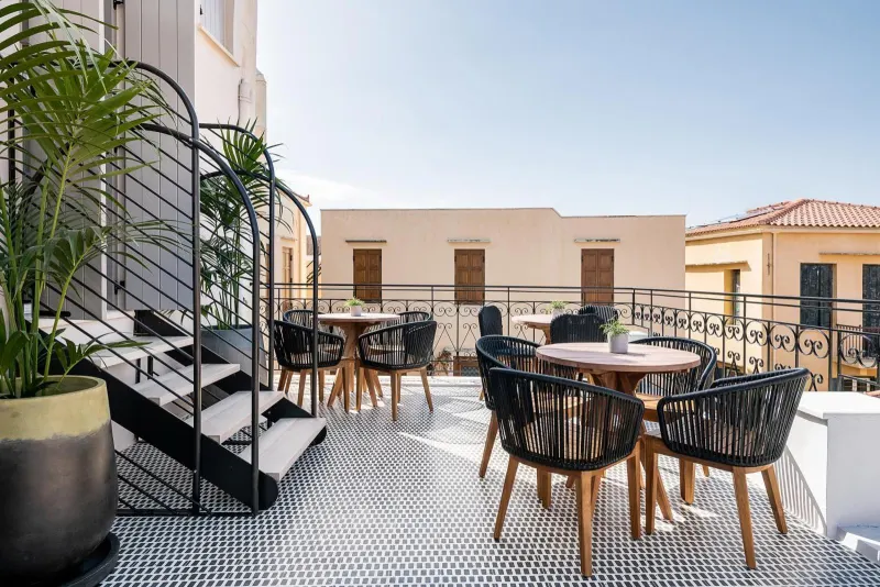 Sunny rooftop terrace with patterned tile floor