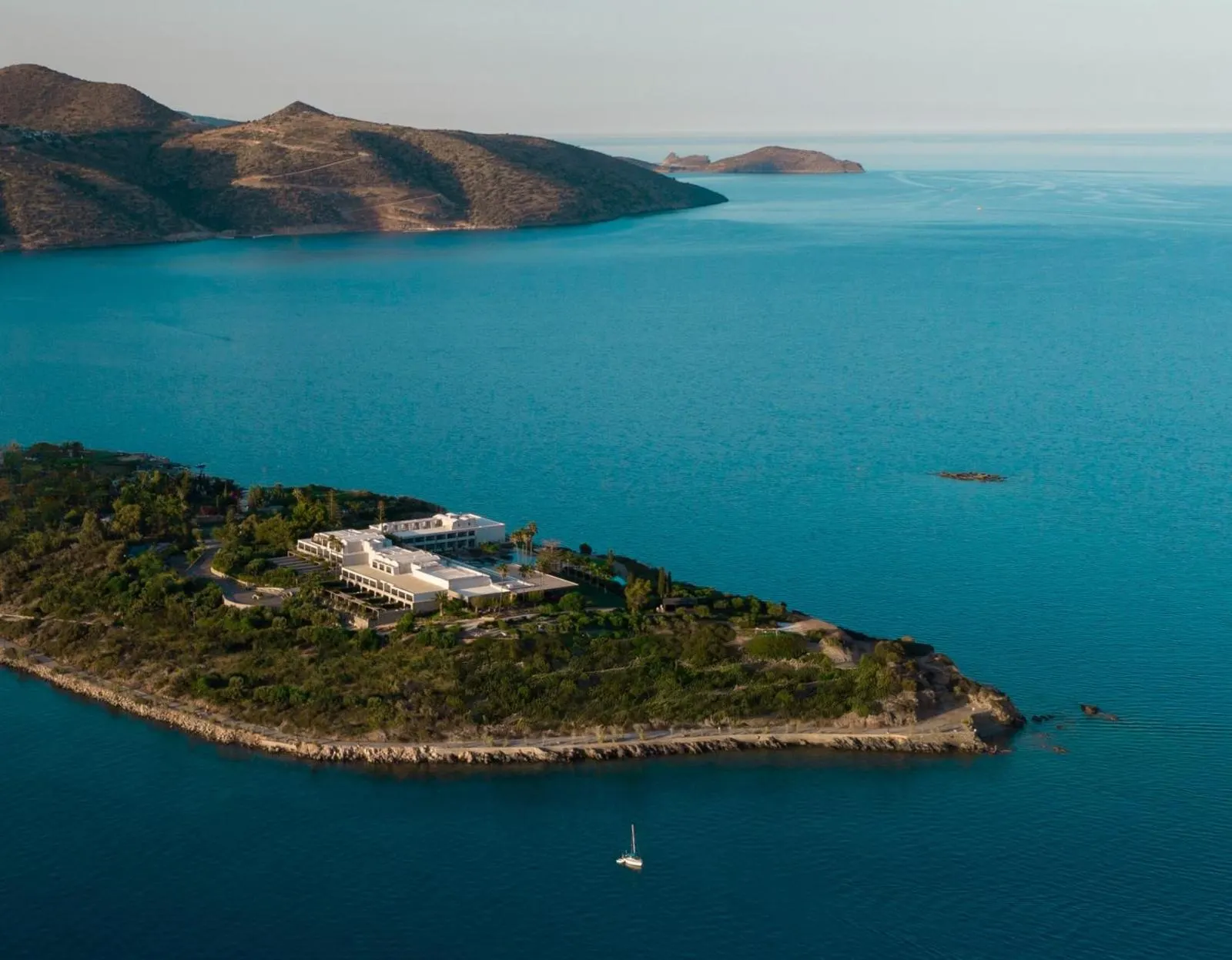 Aerial view of resort peninsula surrounded by sea and mountains