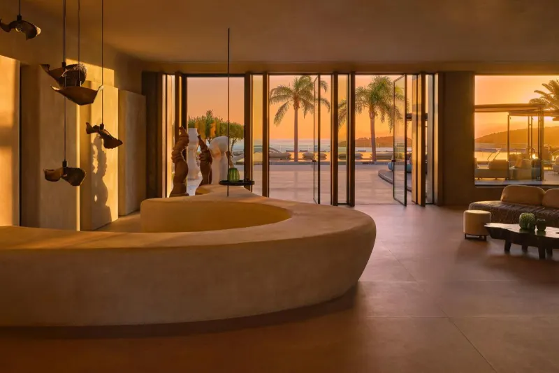 Lobby lounge with sunken seating and sunset ocean view