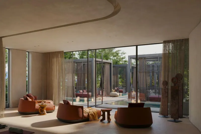 Modern lounge with orange armchairs and garden view