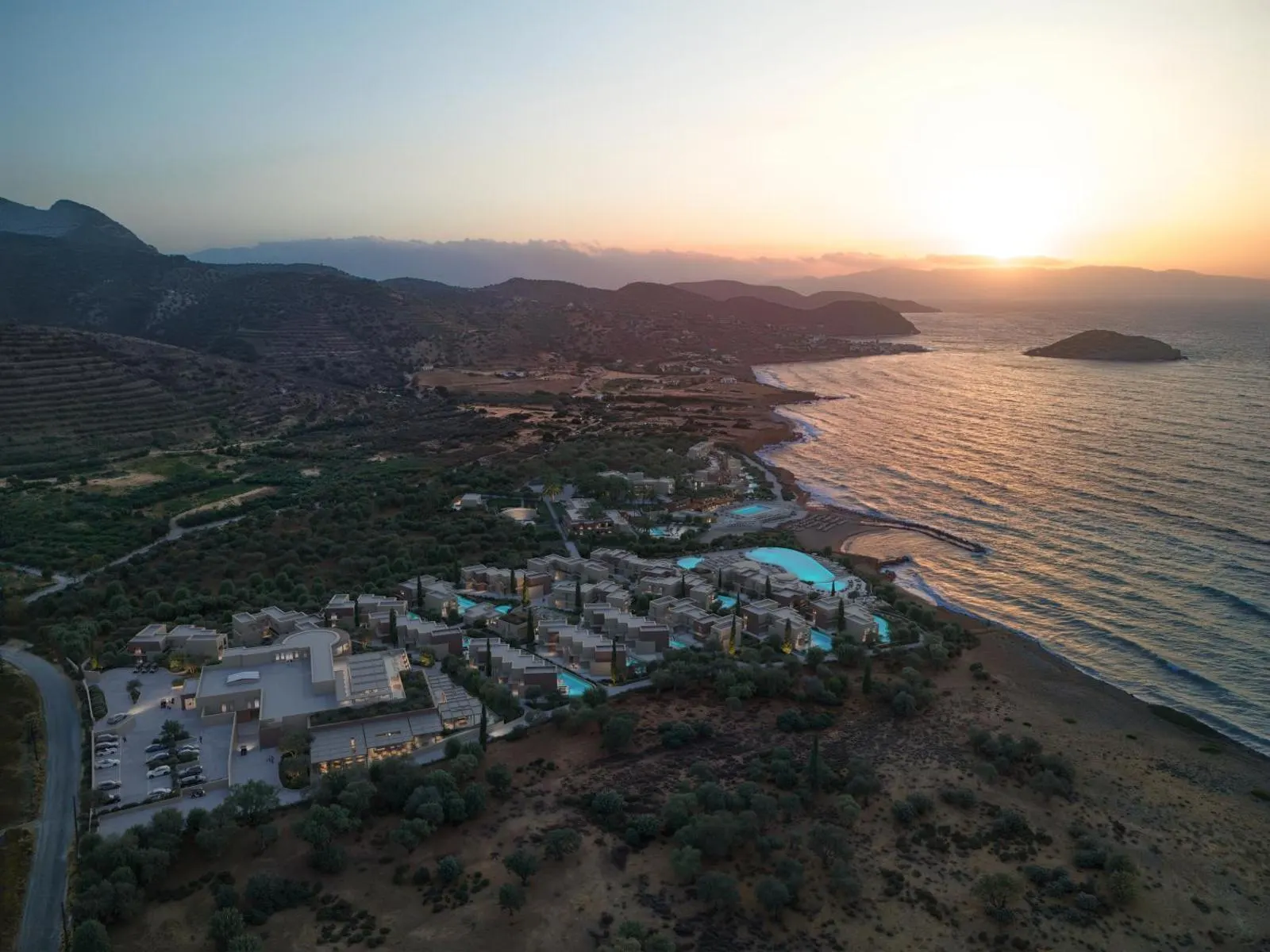 Aerial sunset view of resort along coastline