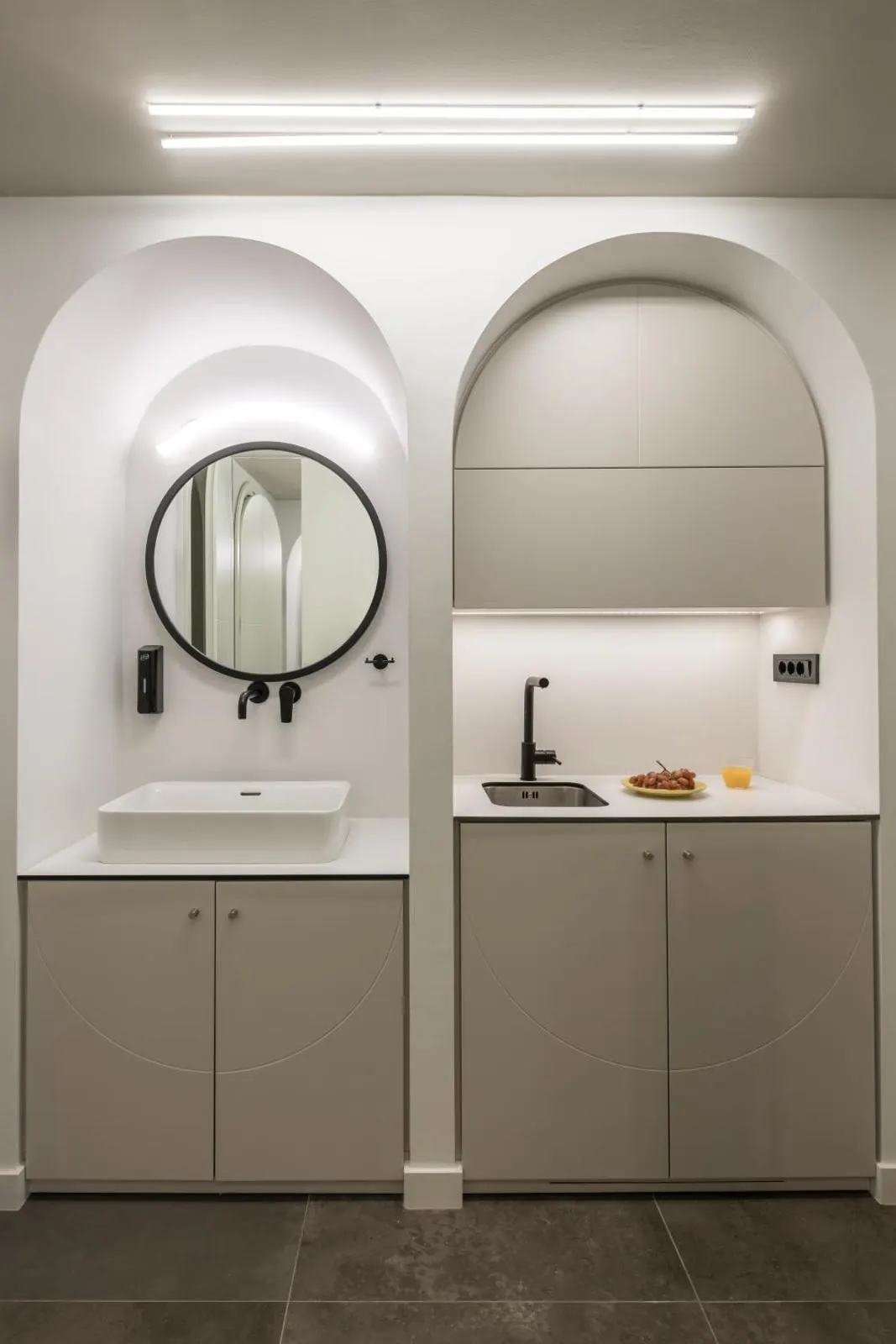 Arched nooks with sink and kitchenette