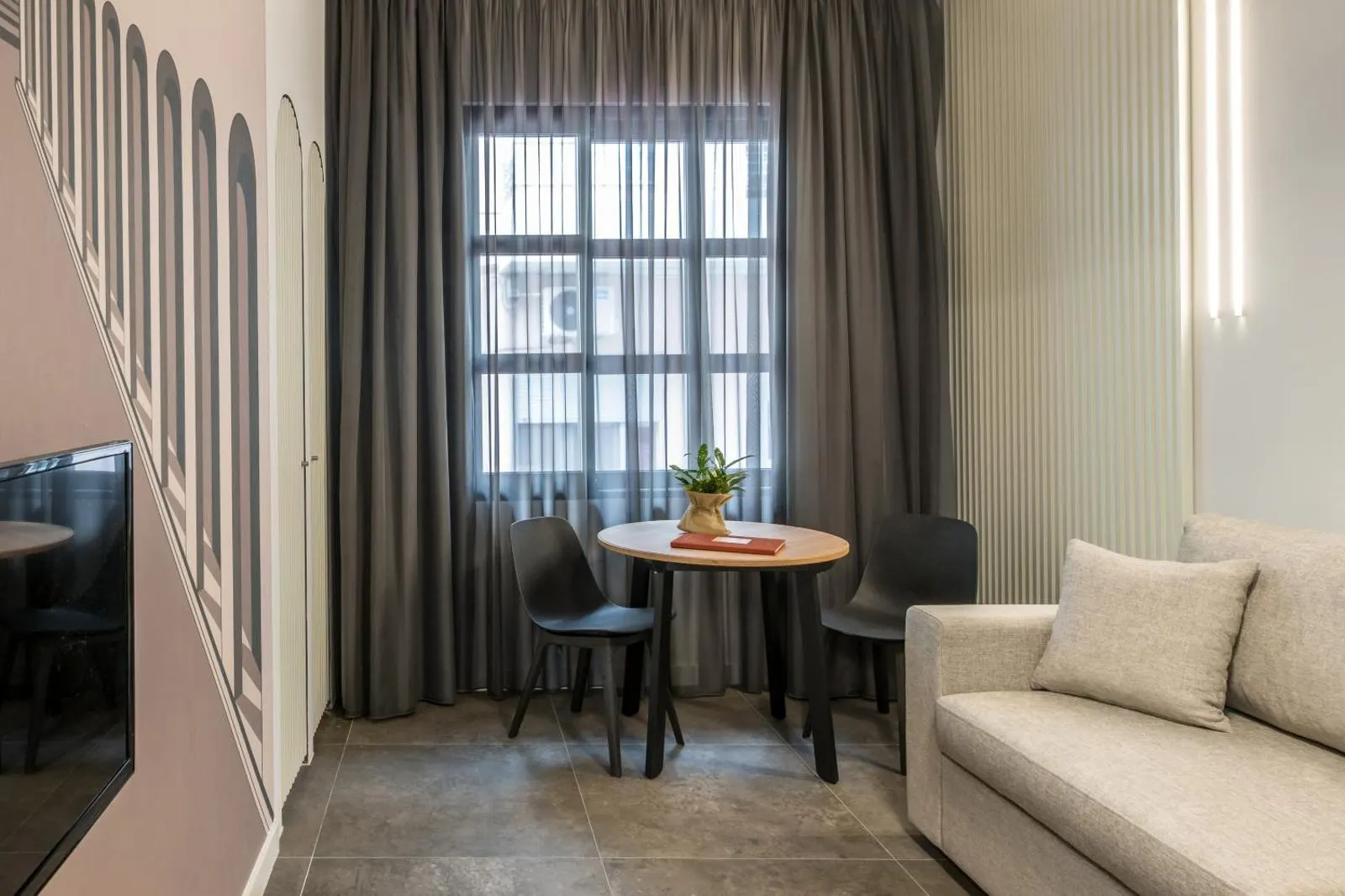 Sitting area with round table and sofa