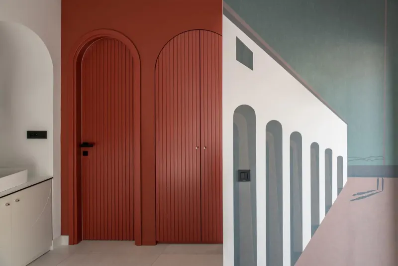 Colorful arched doors and hallway design