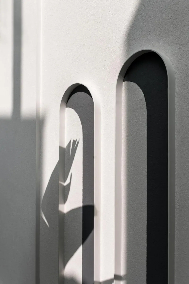 Minimalist arched wall with shadow play