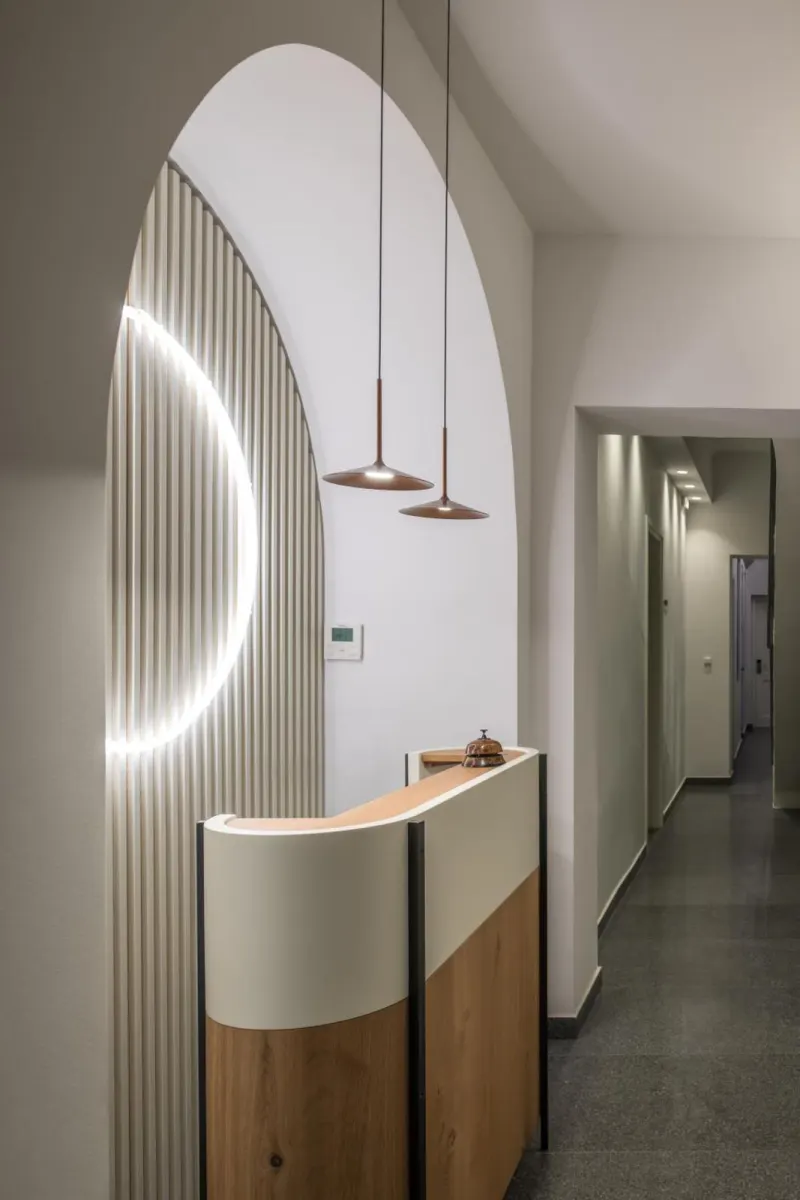 Reception desk under glowing arch design