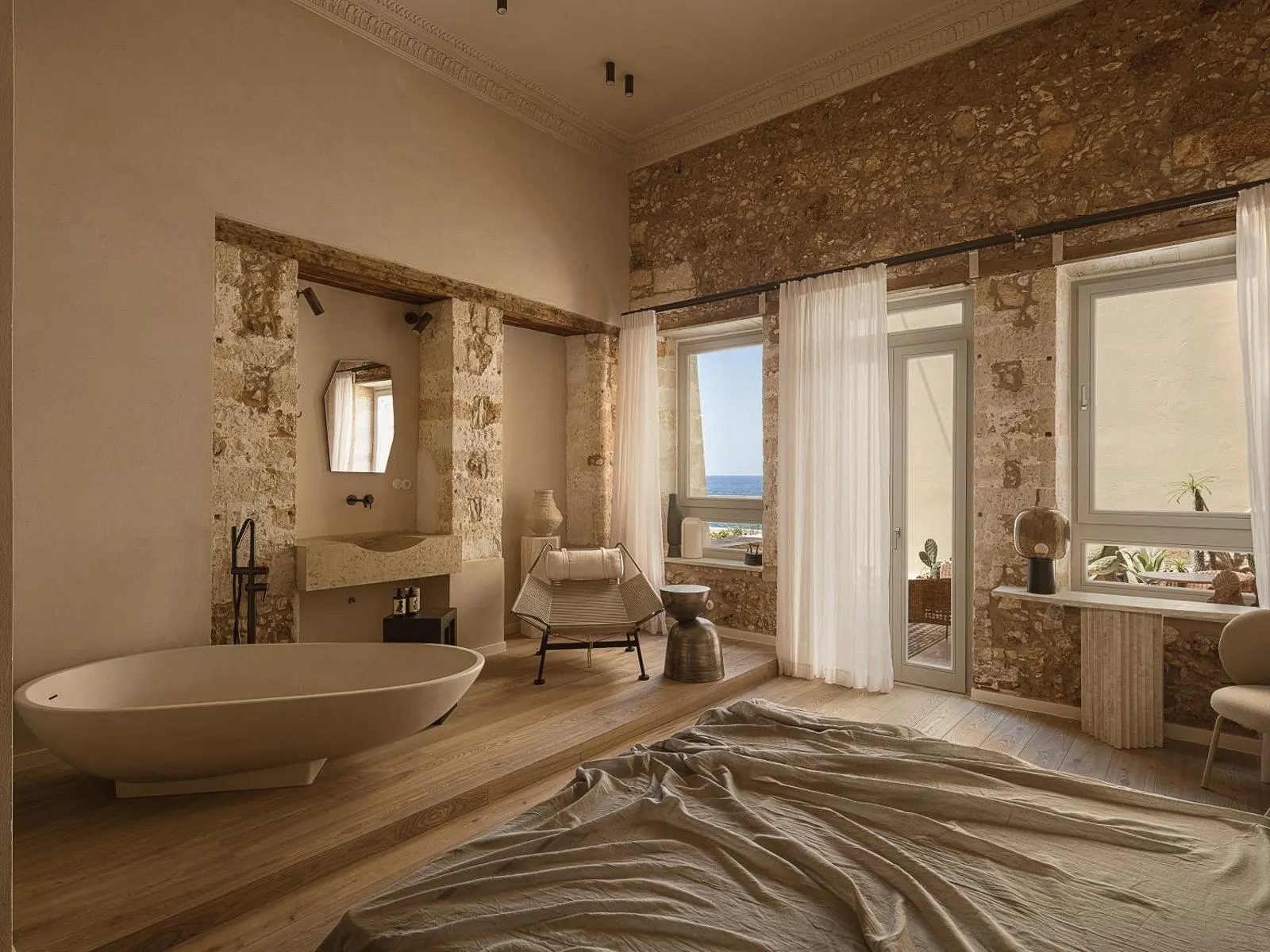 Bathroom with freestanding tub and sea view