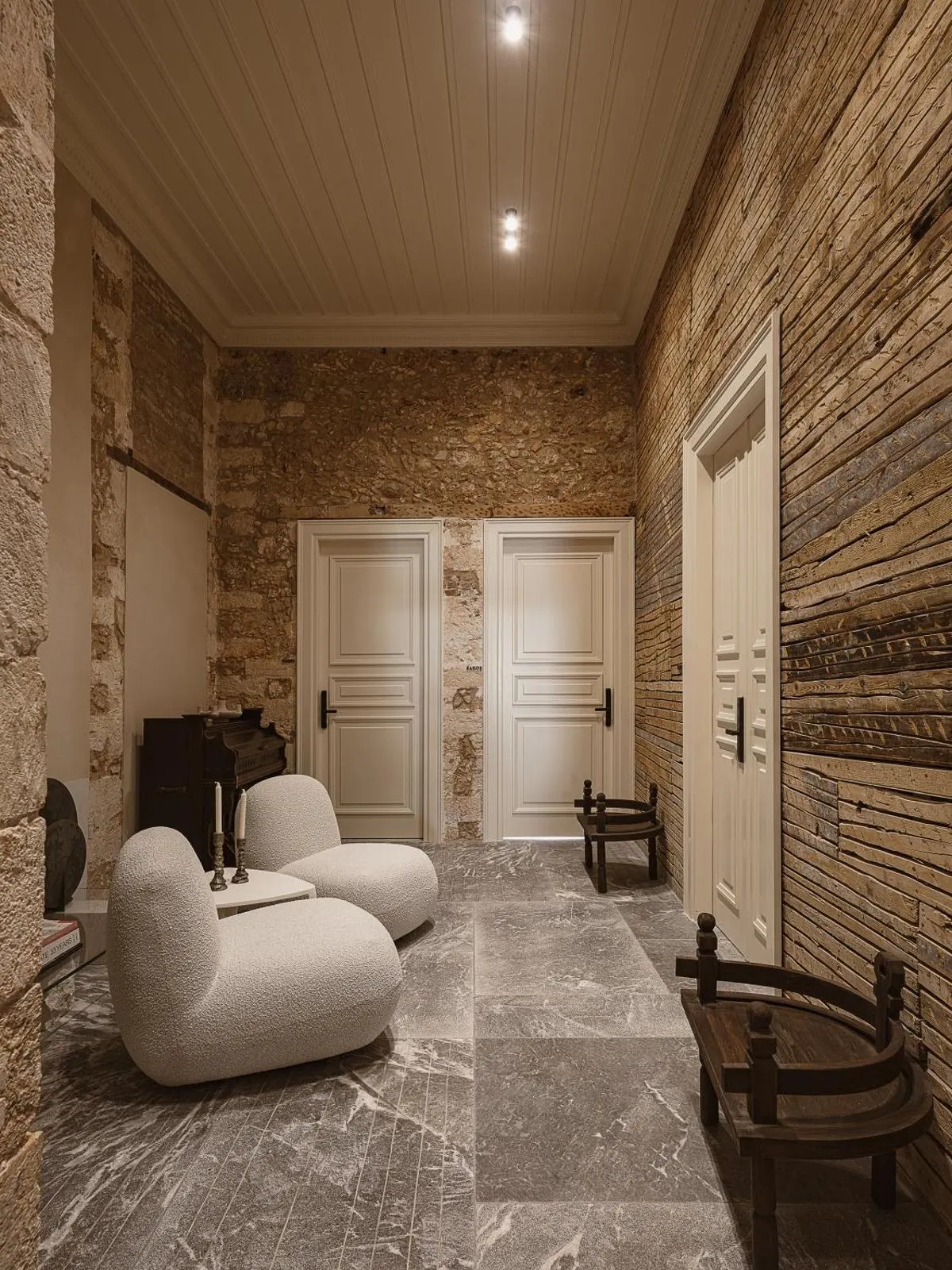 Stone corridor with cozy armchairs