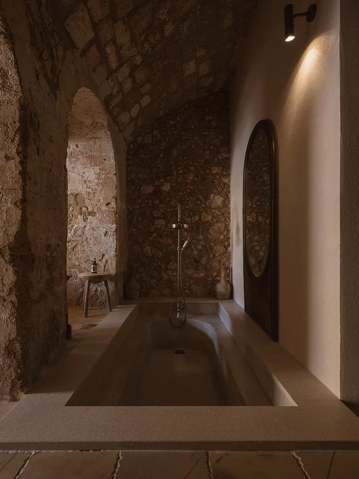 Stone vaulted bathroom with sunken tub