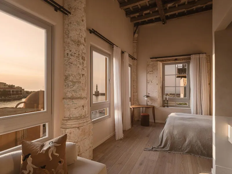 Bedroom with stone walls and sea view windows